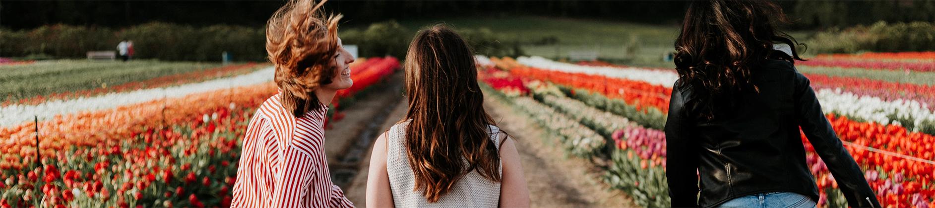 Girls laughing in flower field